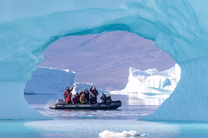 Why should I visit the Arctic in August on an expedition cruise?
