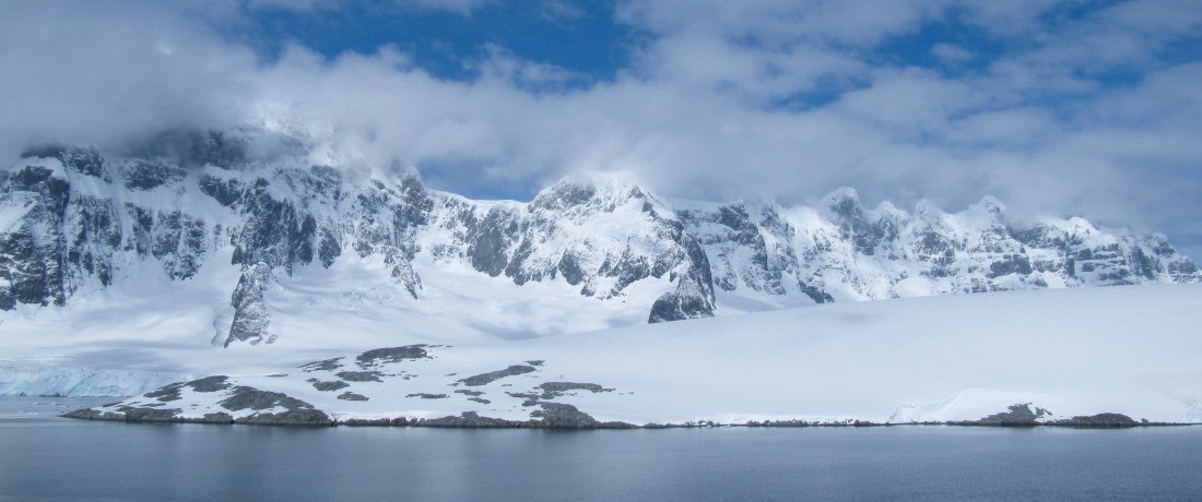 Antarctic scenery, sun with clouds