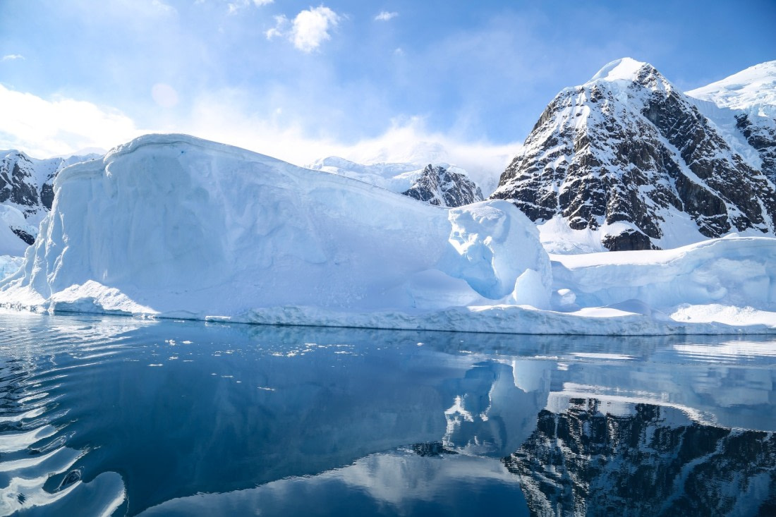Mirrored moutain and iceberg