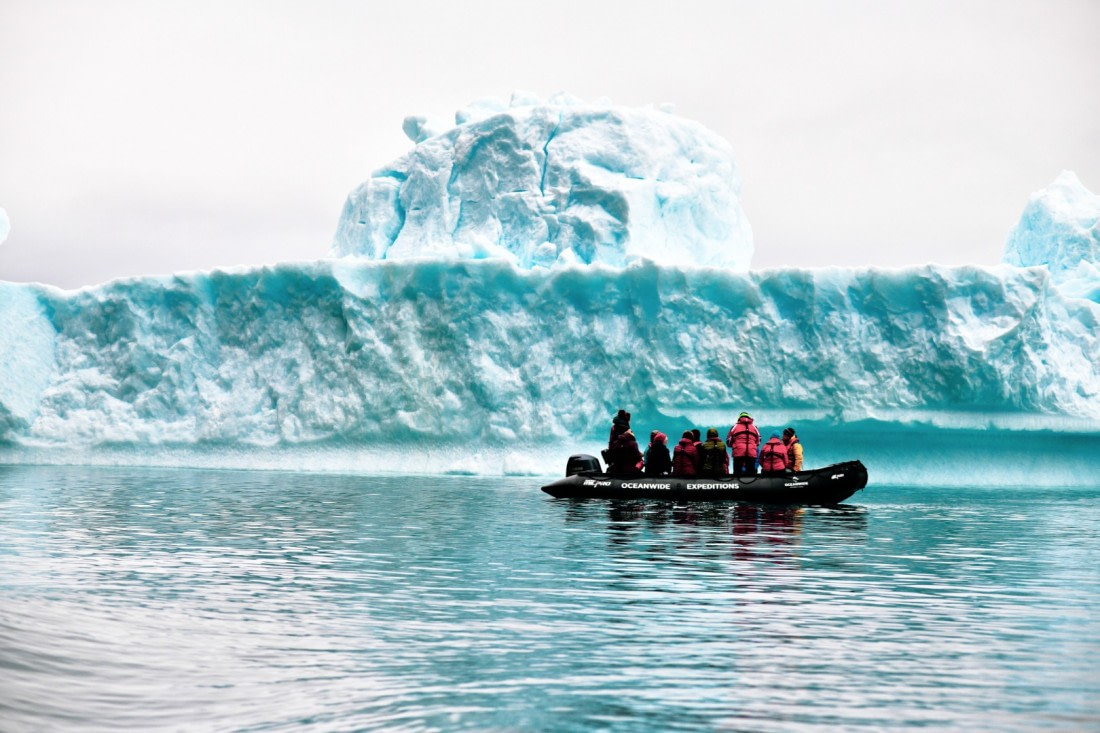 Zodiac cruising, blue iceberg, Greenland © Calvin Sun - Oceanwide Expeditions.jpg