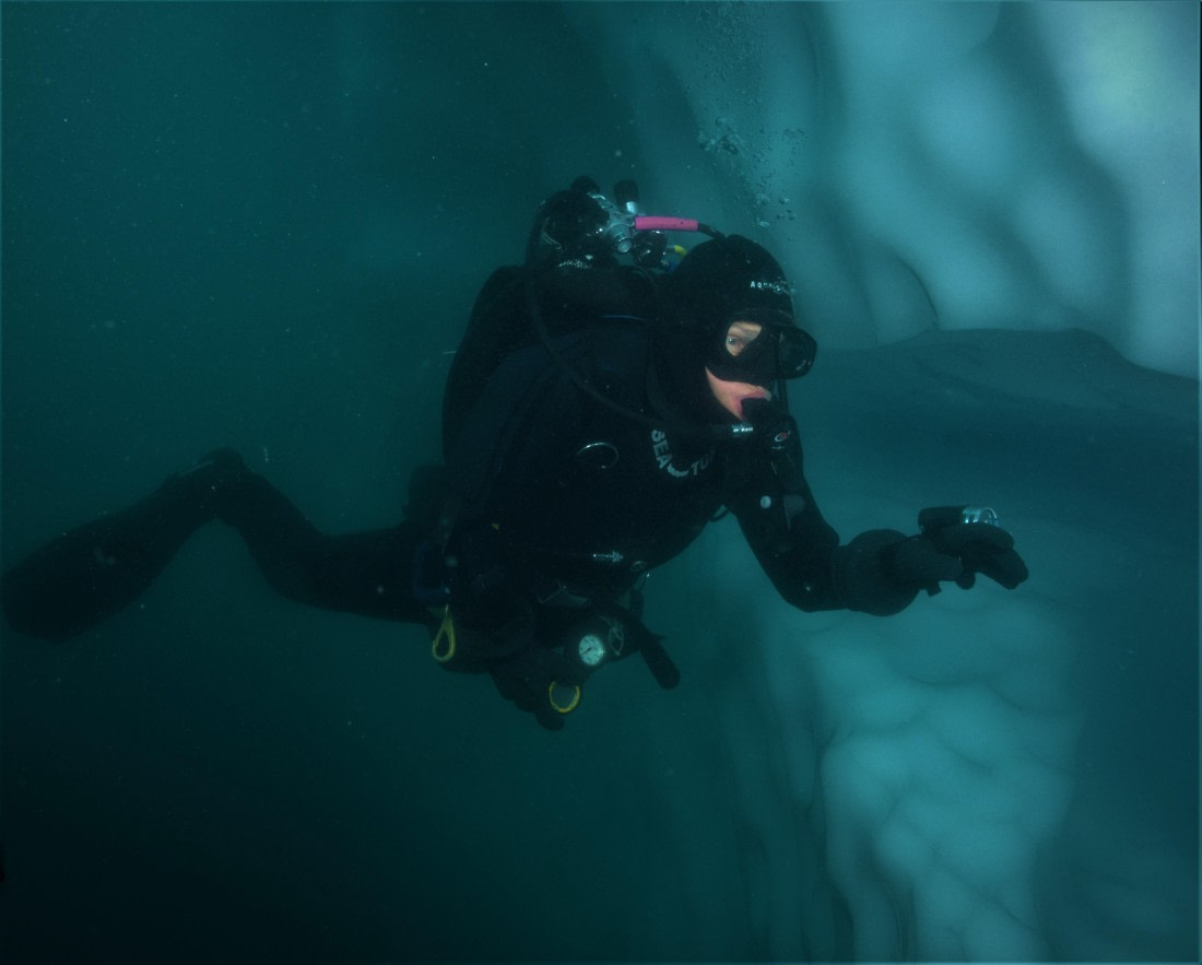 Diving alongside an iceberg