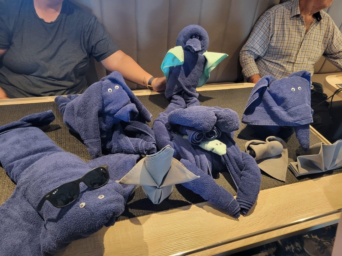 Housekeeping staff lead a demonstration session about folding towels in cute animals