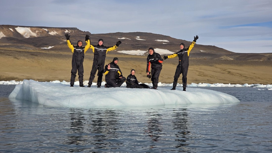 OTL31a26, Day 7, Snorkellers on iceberg 20260323_094755.jpg © Sid Dewfall - Oceanwide Expeditions.jpg
