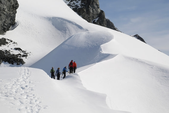 Mountaineers approaching a ridge