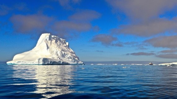 M/V ORTELIUS dwarfed by iceberg