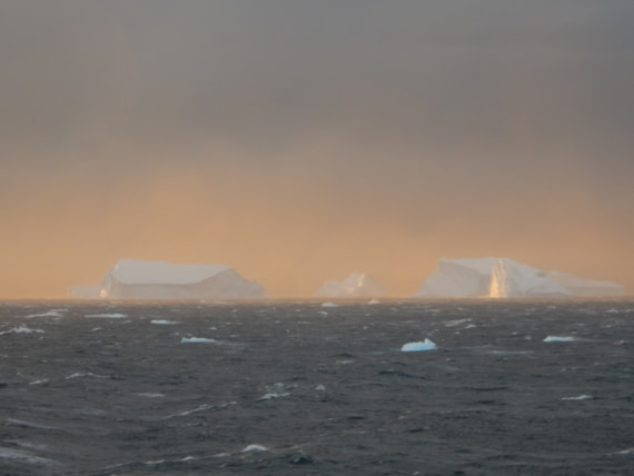Icebergs on fire during sunset.