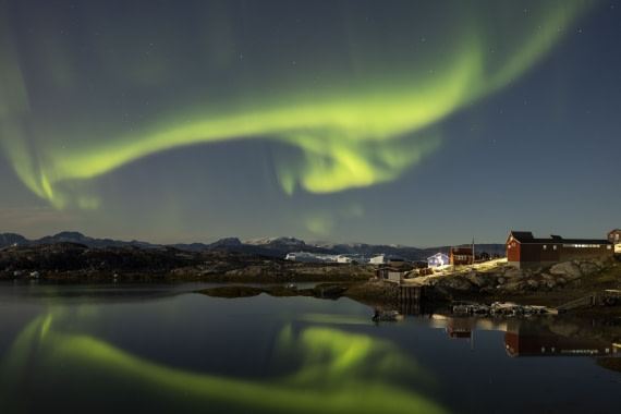 Aurora borealis over the village of Tiniteqilaaq - east coast of Greenland