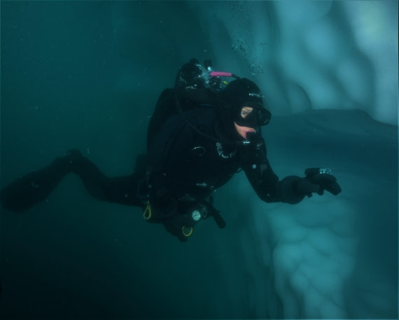 Diving alongside an iceberg