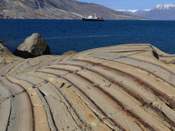 PLA11-24, Day 8,  Stripey yellow rocks with Plancius 1 © John Rogers - Oceanwide Expeditions.JPG
