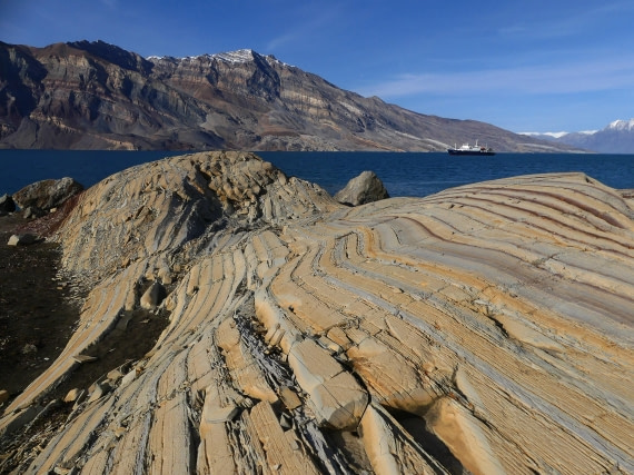 PLA11-24, Day 8,  Stripey yellow rocks with Plancius 2 © John Rogers - Oceanwide Expeditions.JPG