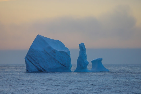 Triple iceberg during sunrise