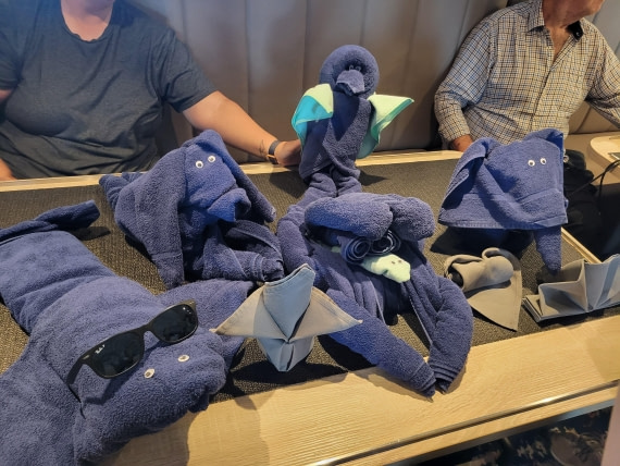 Housekeeping staff lead a demonstration session about folding towels in cute animals