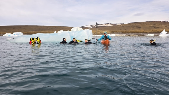 OTL31a26, Day 7, Kayak and snorkellers around berg 20260323_101647.jpg © Sid Dewfall - Oceanwide Expeditions.jpg